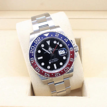 Rolex GMT-Master II 126710BLRO Pepsi Bezel Stainless Steel Luxury watch with a blue and red bezel on a white cushion