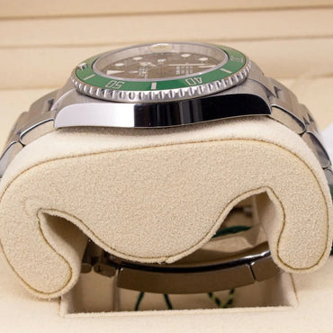 Rolex Submariner Date 126610LV Starbucks Green Bezel Black Dial Watch with green bezel on a beige cushion