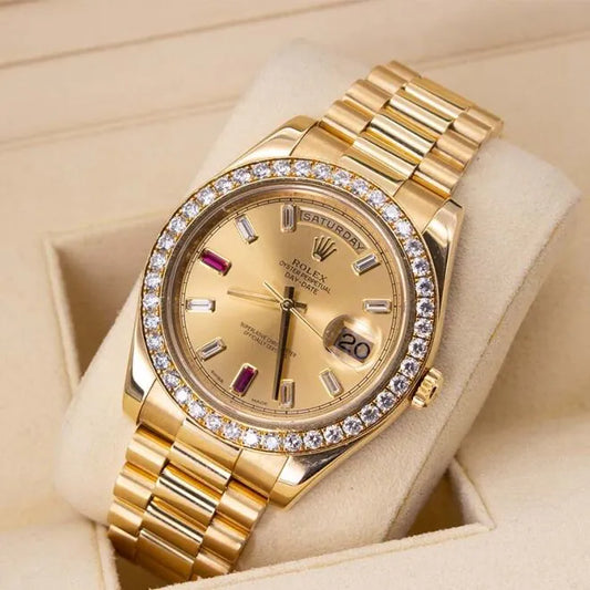 Rolex Day-Date II 218348 18ct Yellow Gold Factory Diamond Bezel & Ruby Dial Gold wristwatch with diamond bezel on a beige cushion