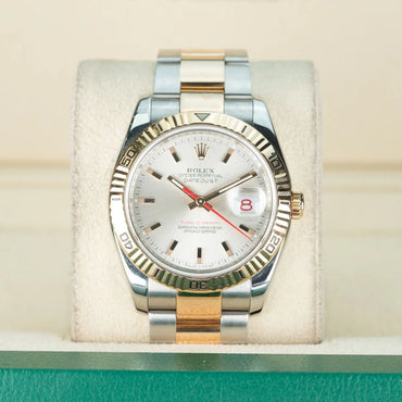 Rolex Datejust 116261 Turn O GraphTwo-tone Rolex watch on a display stand with a light background