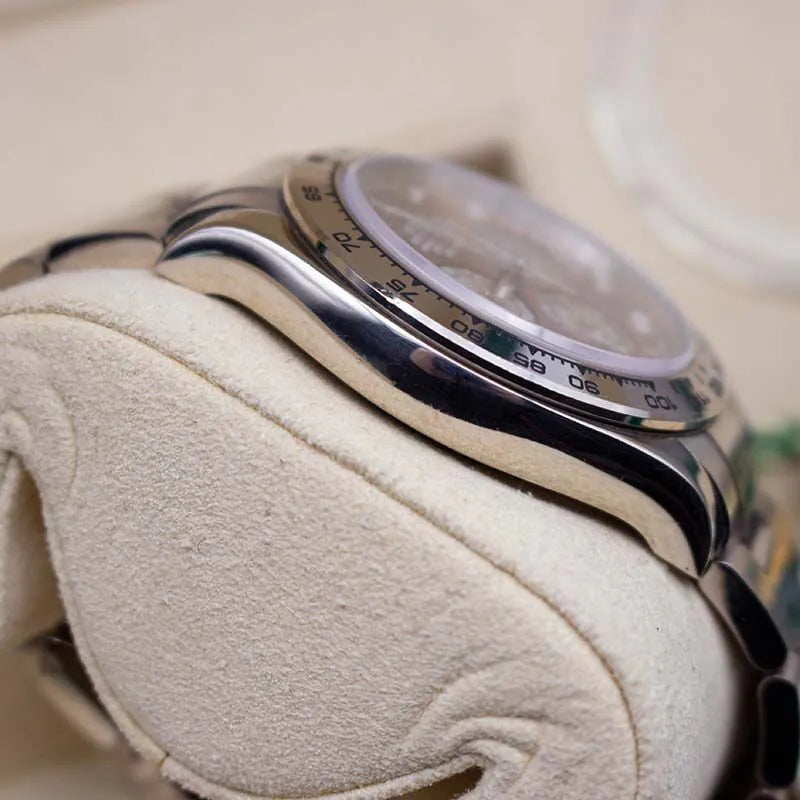 Rolex Daytona 116509 Tahitian Mother of Pearl Dial  Close-up of a silver watch with a textured beige strap on a blurred background