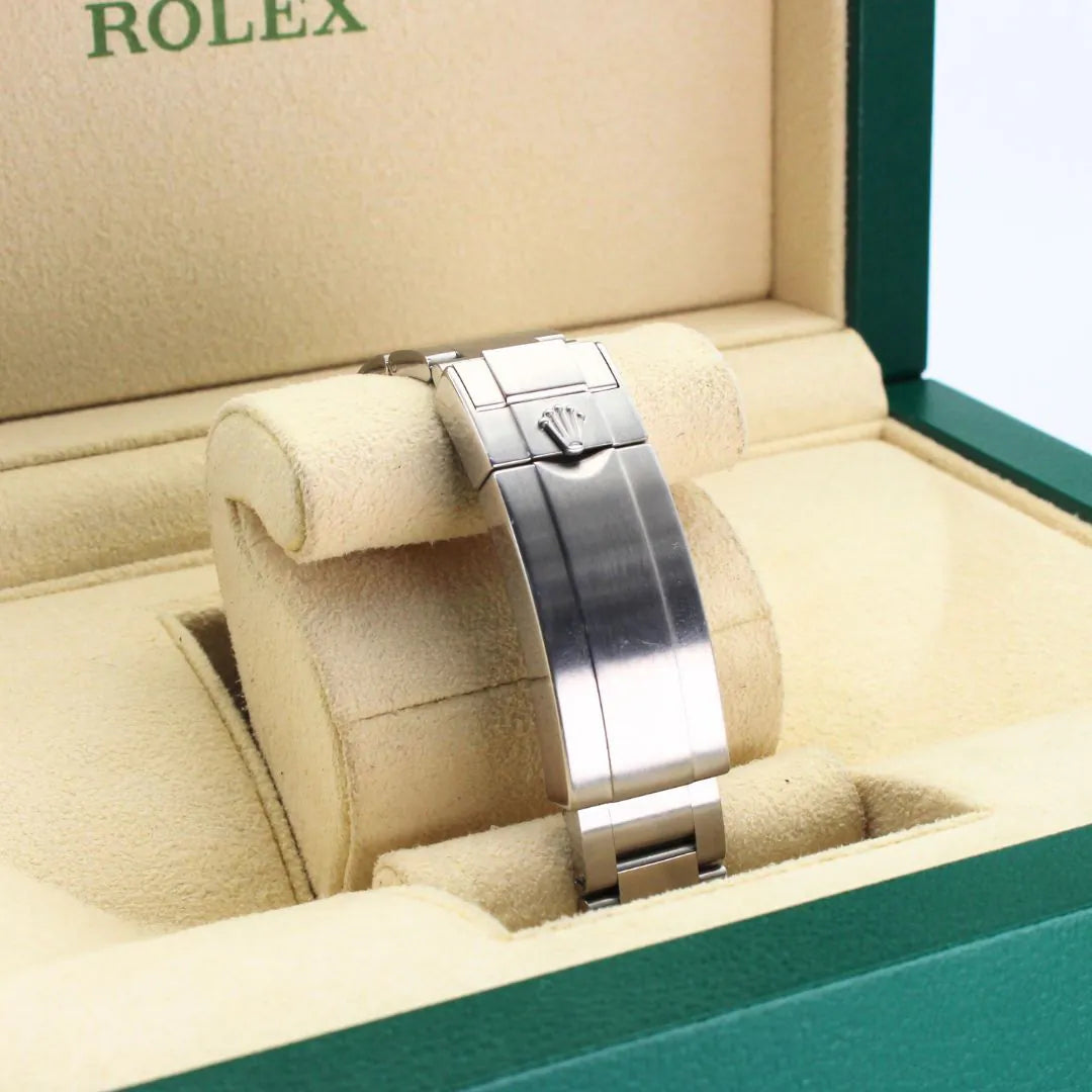 Rolex Submariner 116610LV Hulk Watch Silver Rolex watch in a beige cushioned box with 'Rolex' branding.