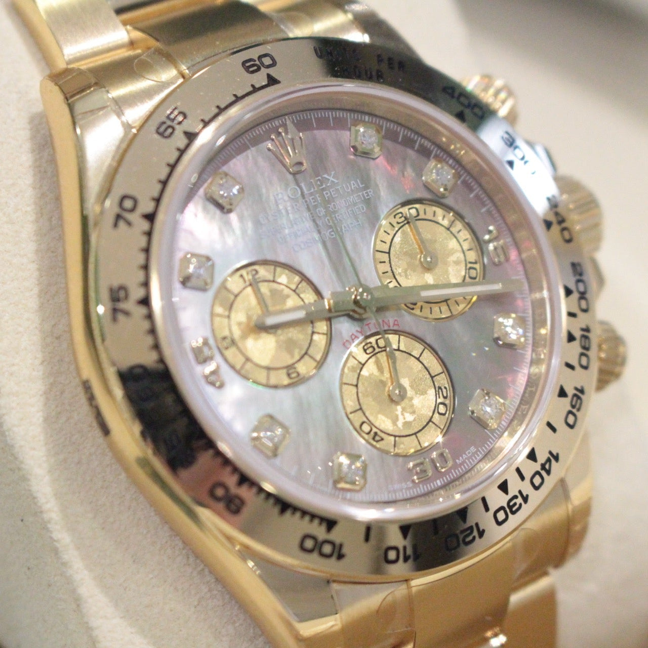 Rolex Cosmograph Daytona 116508 – Tahitian Mother of Pearl Dial, 18ct Yellow Gold Gold wristwatch with a detailed face on a light background
