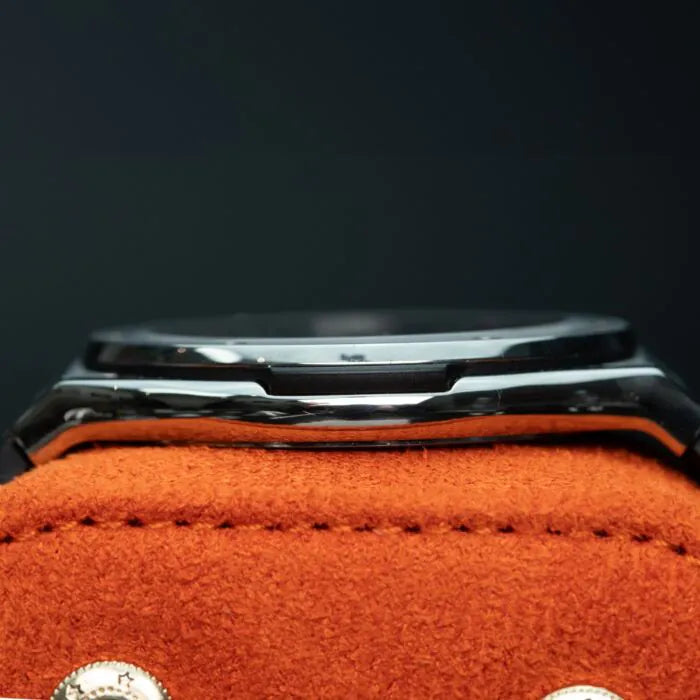 Hublot Classic Fusion Ultra-Thin 515.NX.1270.LR Titanium 45mm Black Dial Close-up of a watch with a black strap on an orange fabric background