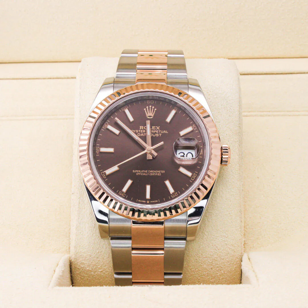 Rolex Datejust 41 126331 Watch – Chocolate Dial Luxury watch with brown dial and rose gold accents on a beige cushion