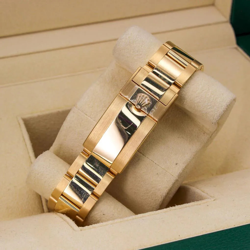 Rolex Cosmograph Daytona 116508 Black Diamond Dial Gold bracelet with a brand logo on a beige cushion in a jewelry box