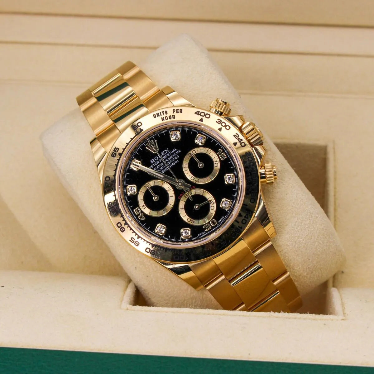 Rolex Cosmograph Daytona 116508 Black Diamond Dial Gold watch with black dial on a beige cushion