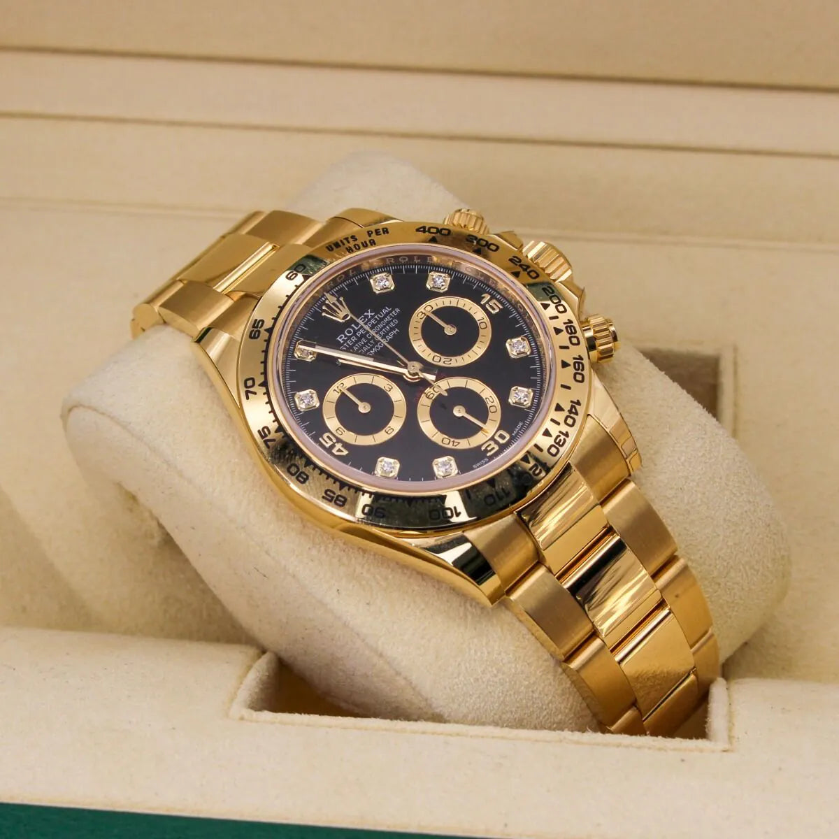 Rolex Cosmograph Daytona 116508 Black Diamond Dial Gold wristwatch with a black face on a white cushion