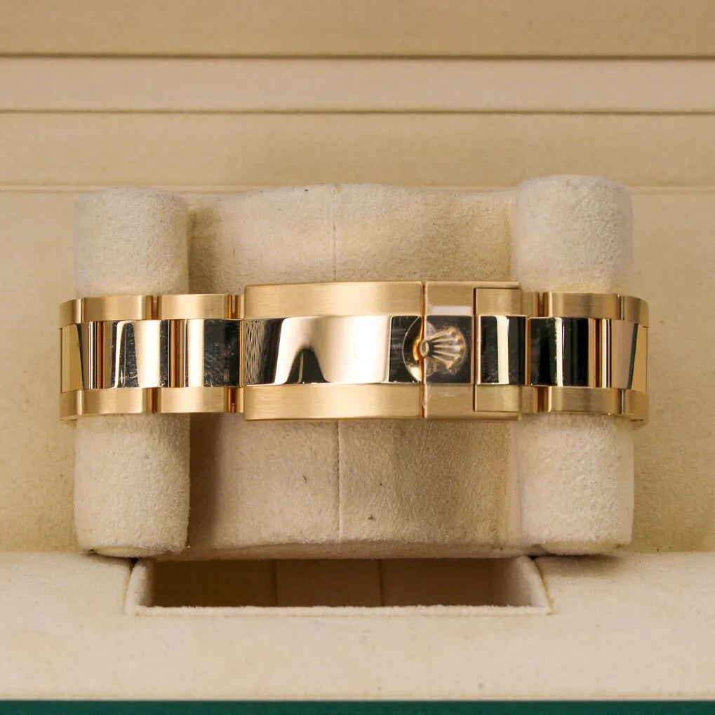 Rolex Cosmograph Daytona 116508 Black Diamond Dial Gold bracelet on a textured beige surface