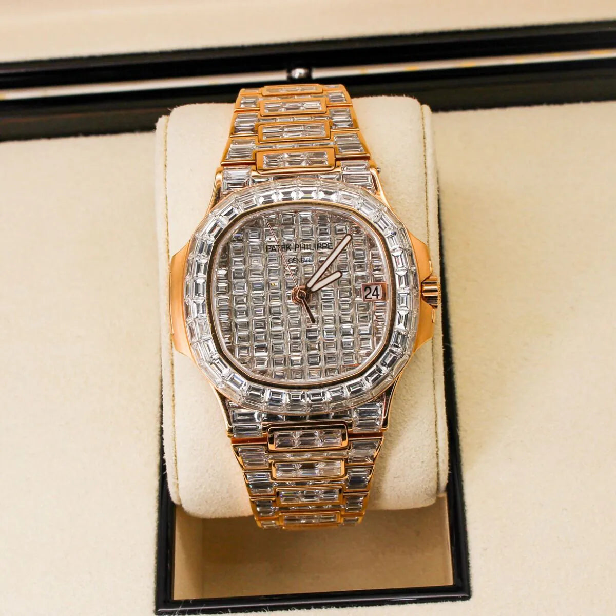 Patek Philippe Nautilus 5711/1R 18K Rose Gold Baguette Diamond Set  Luxury diamond-encrusted watch in a display case