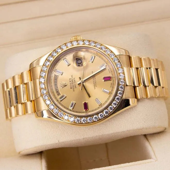 Rolex Day-Date II 218348 18ct Yellow Gold Factory Diamond Bezel & Ruby Dial  Gold wristwatch with diamond-studded bezel on a beige background