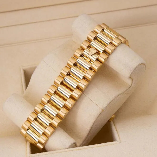 Rolex Day-Date II 218348 18ct Yellow Gold Factory Diamond Bezel & Ruby Dial  Gold watch bracelet in a display box on a beige background