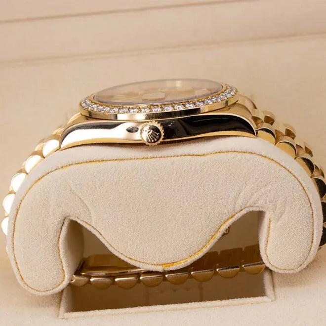 Rolex Day-Date II 218348 18ct Yellow Gold Factory Diamond Bezel & Ruby Dial  Luxury watch with gold case and diamond-studded bezel on a beige background