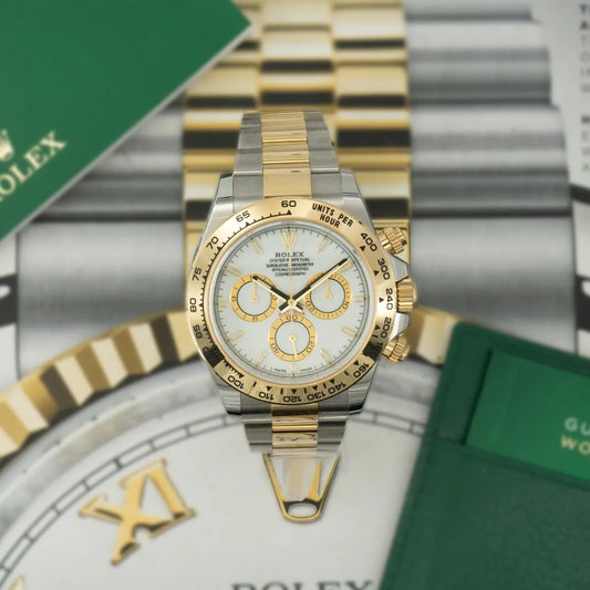 Rolex Daytona 126503 White Dial 18ct Yellow Gold & Steel 2024 Two-tone Rolex watch with gold and silver band on a blurred background