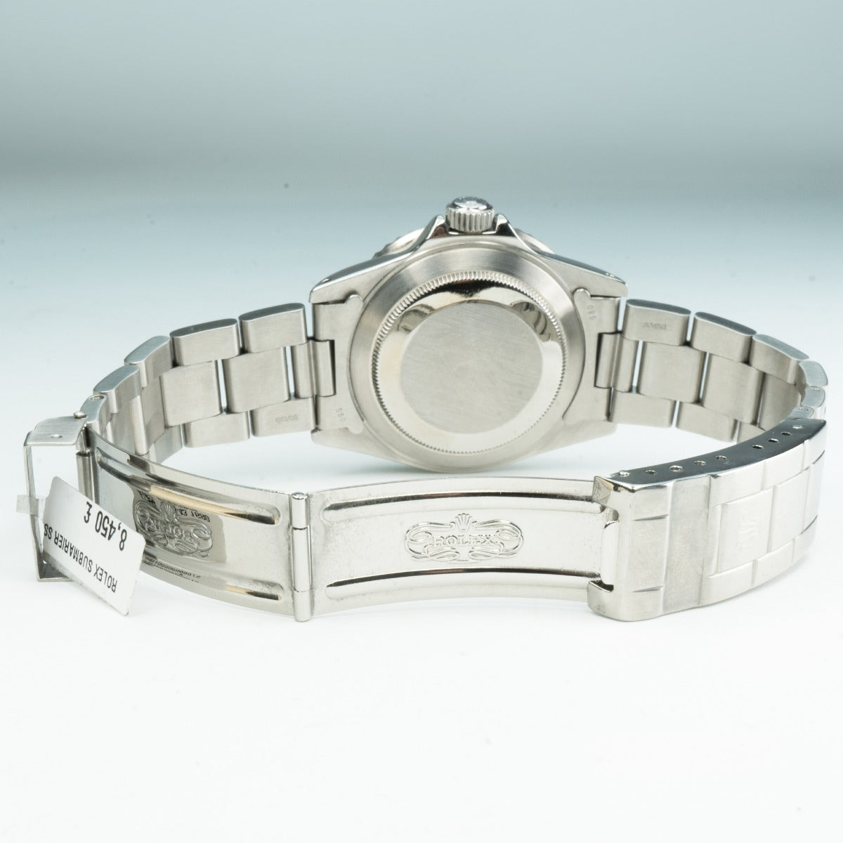 Rolex Submariner 16800 Watch Silver watch with a brand logo on a light gray background